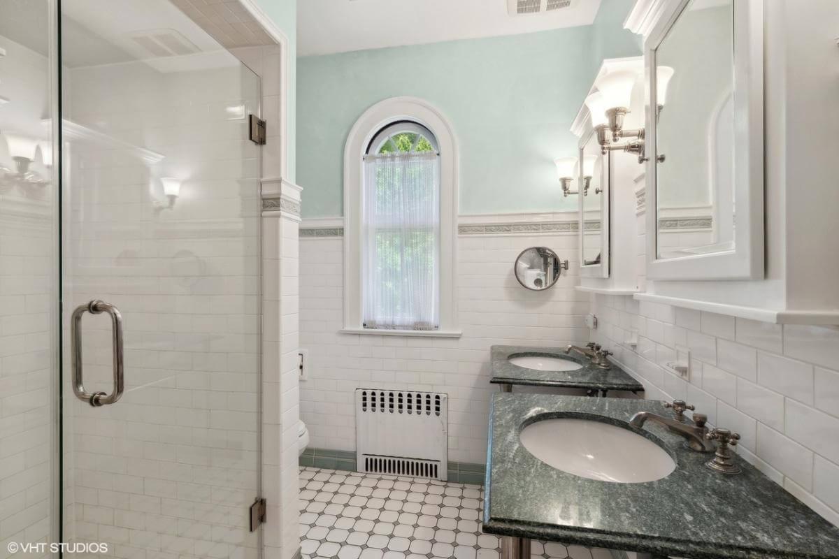 Classic Bathroom with Elegant Hexagonal Tile and Arched Window