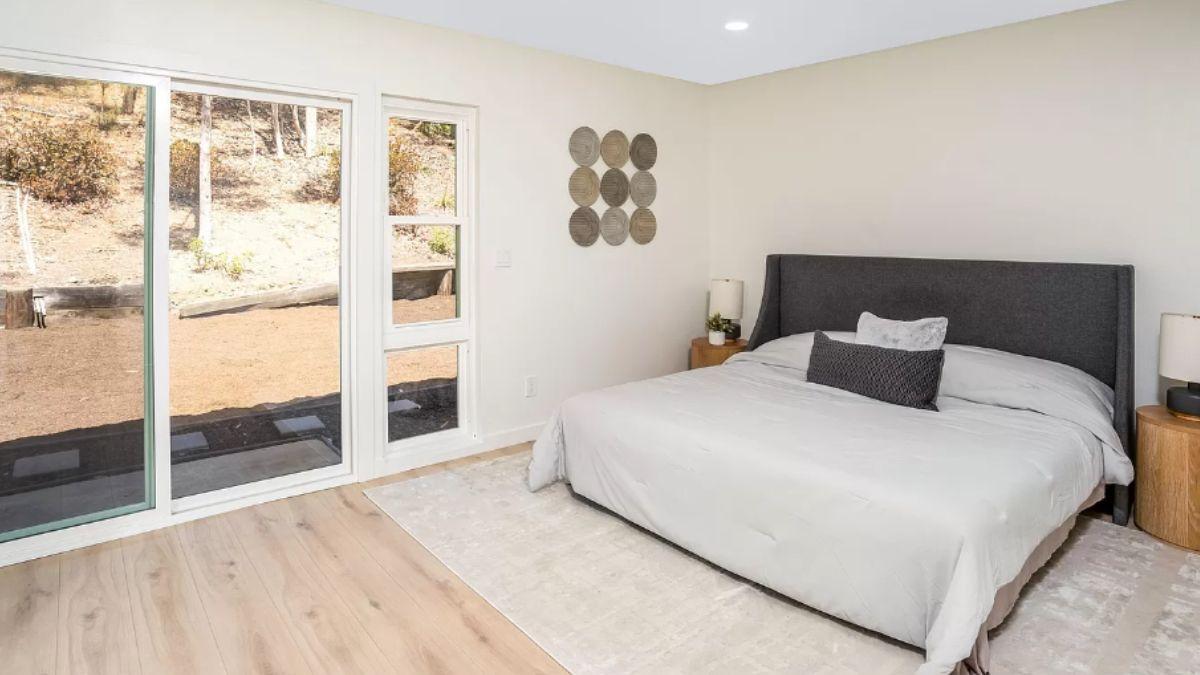 Experience the Serenity of This Bedroom with Soft Textures and Natural Views