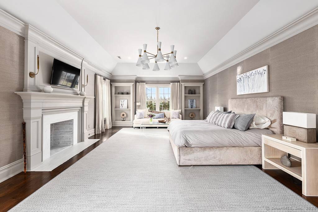 Luxurious Primary Bedroom with a Fireplace and Built-In Shelving