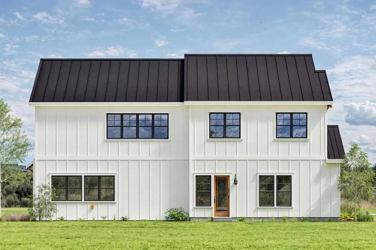 Admire the Contrasting Black Metal Roof on This Farmhouse
