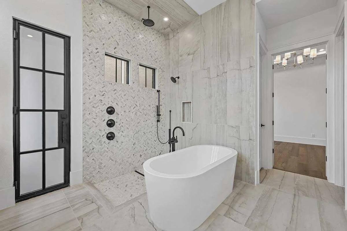 Check Out the Sleek Marble Tile and Modern Fixtures in This Spa-Like Bathroom