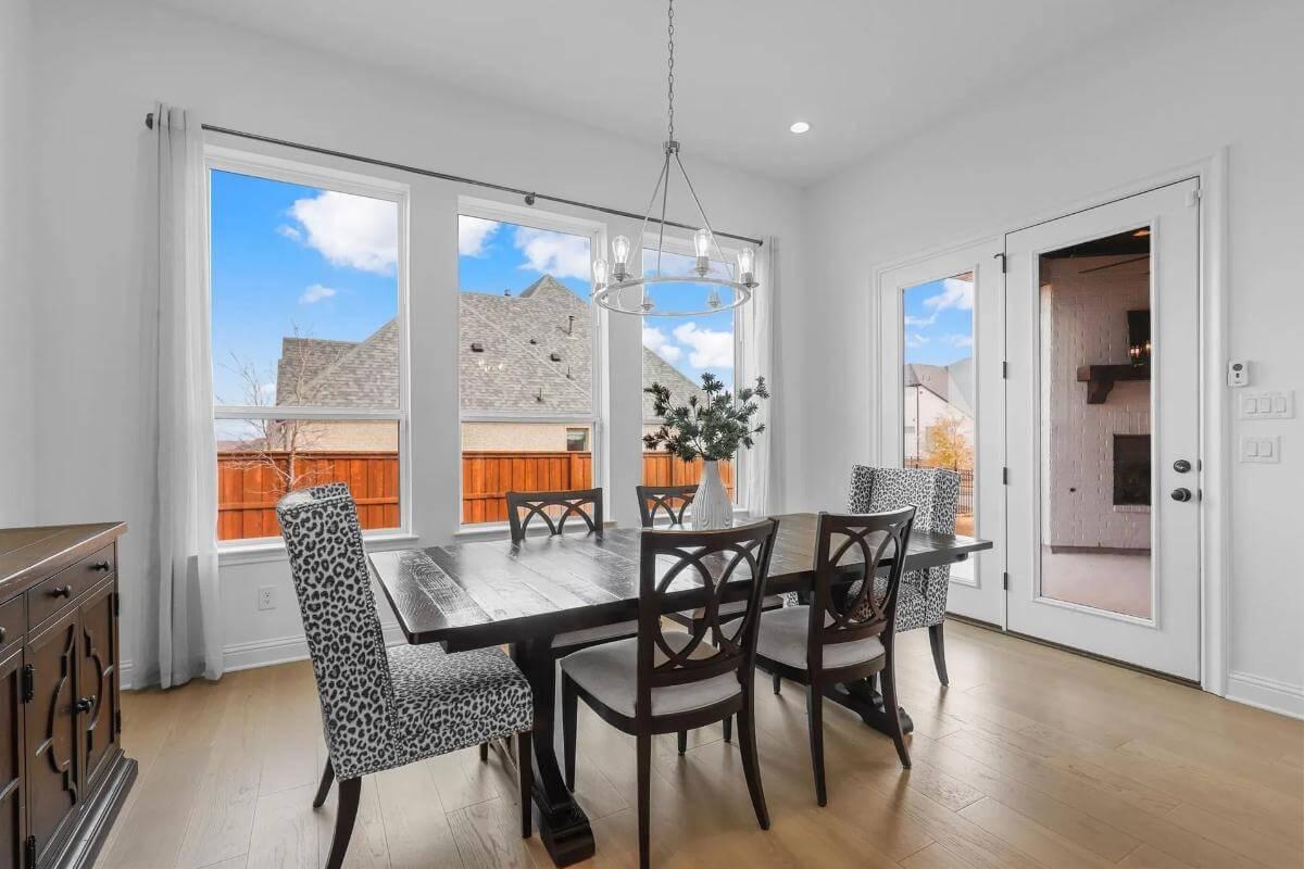 Wow, Check Out Those Patterned Chairs in This Bright Dining Area