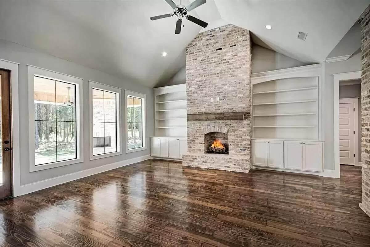 Wow, Look at the Vaulted Ceiling and Brick Fireplace in This Living Room