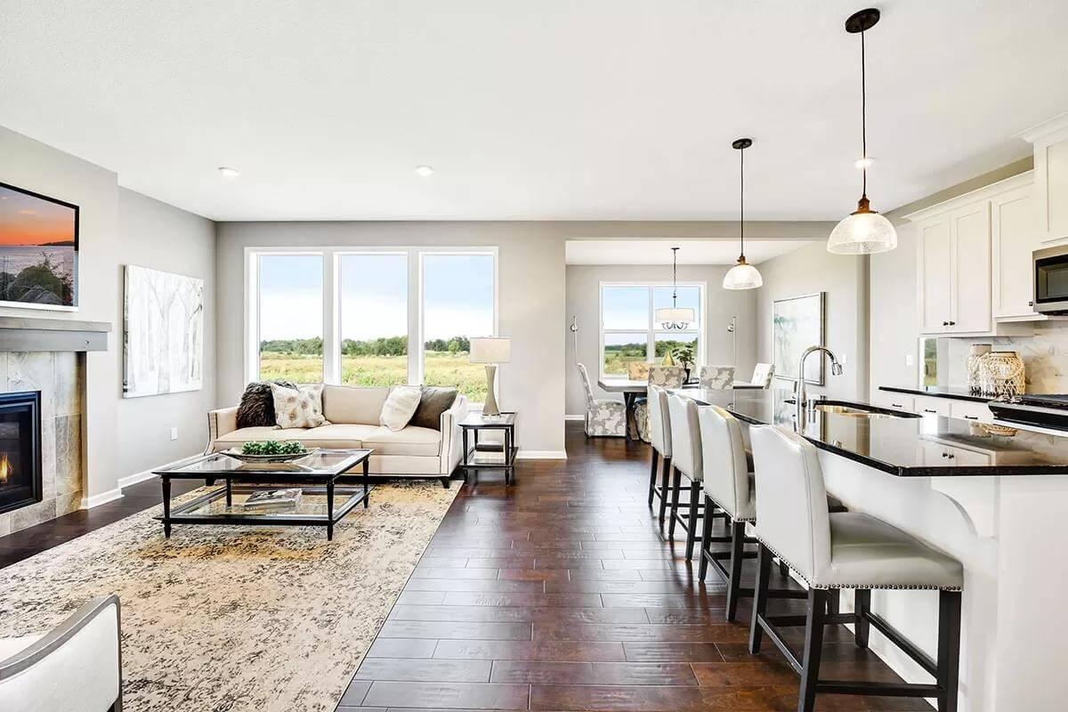 Open-Plan Living Area with Scenic Views and a Polished Fireplace