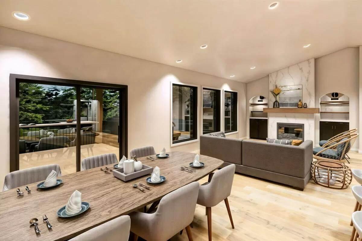 Notice the Seamless Transition from Dining to Living Area with Marble Fireplace