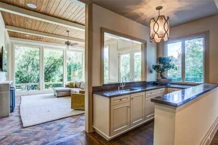 Notice the Natural Wood Ceiling and Brick Flooring in This Sunlit Space