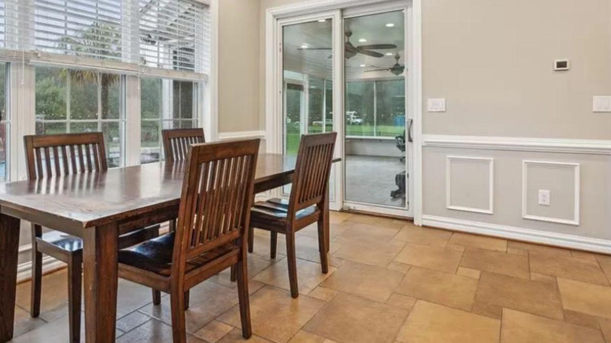 Check Out This Dining Space with a View to the Sunroom