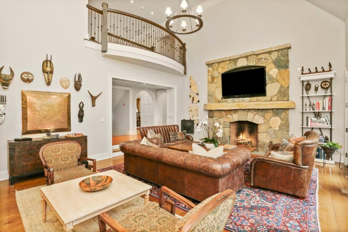 Stone Fireplace and Leather Sofas: A Craftsman Living Room with Global Flair