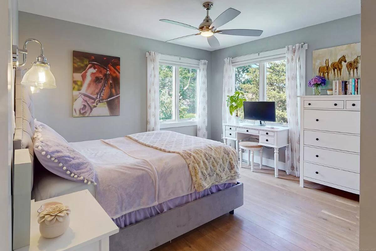 Charming Bedroom with Delightful Equestrian Art and Cozy Desk Nook