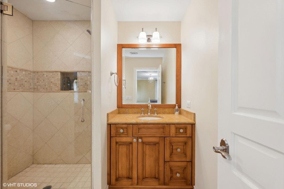 Check Out the Rich Wood Vanity in This Classic Bathroom