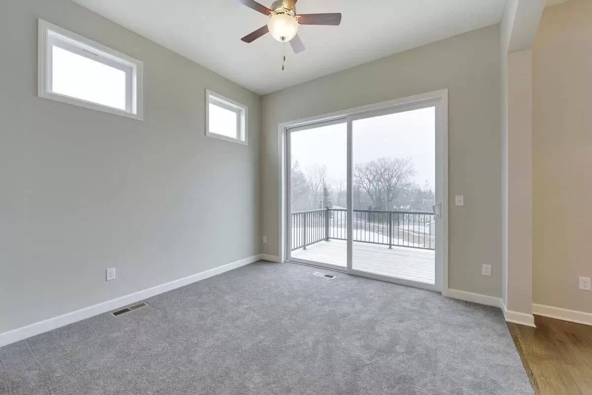 Take in the Bright Ambiance with Sleek Sliding Doors to the Deck