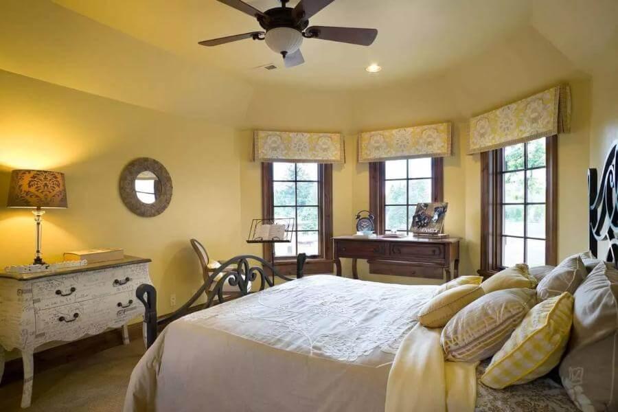 Charming Bedroom with Bay Windows and Vintage Accents
