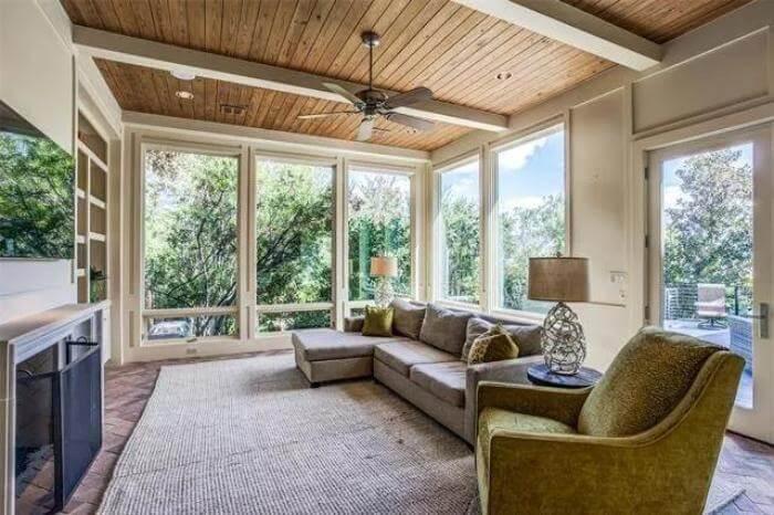 Natural Wood Ceiling and Floor-to-Ceiling Windows Create a Serene Lounge