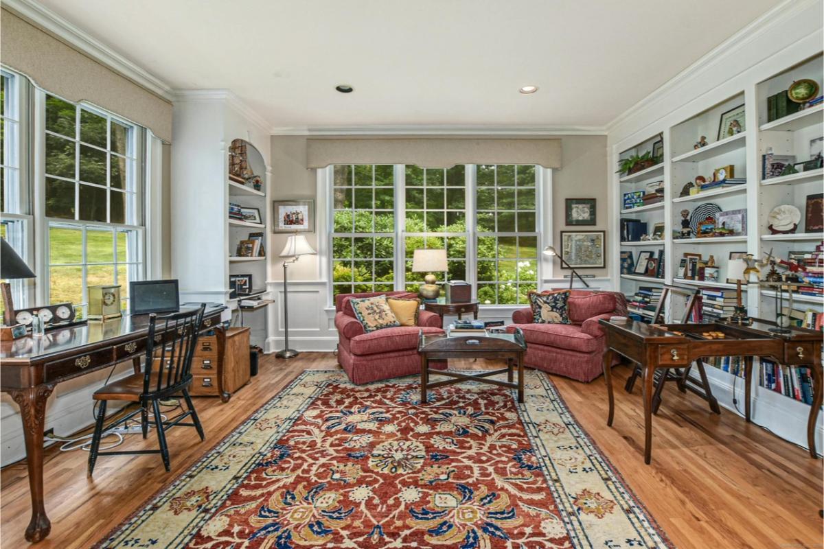 Cozy Home Office with Built-In Shelves and a Scenic View