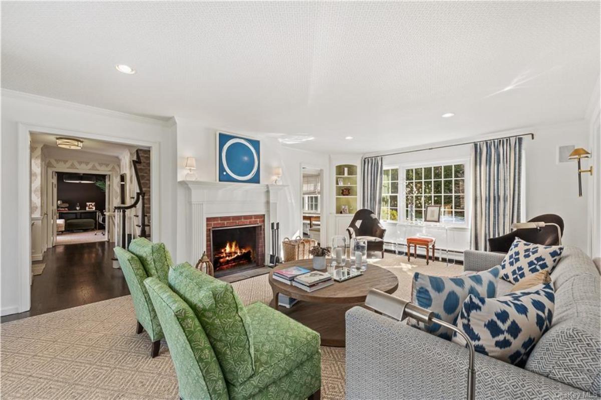 Timeless Living Room with a Classic Fireplace and Pops of Color