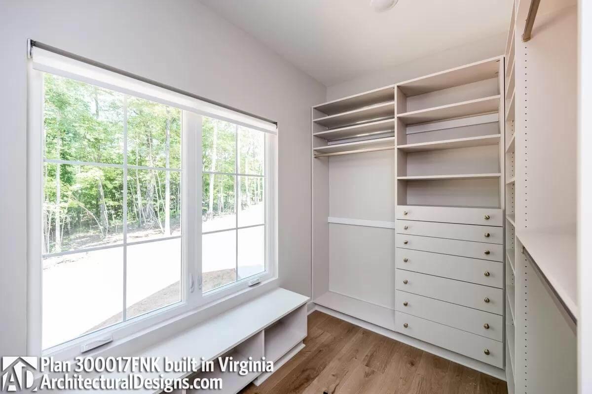 Check Out This Walk-In Closet with Forest Views Through Expansive Windows