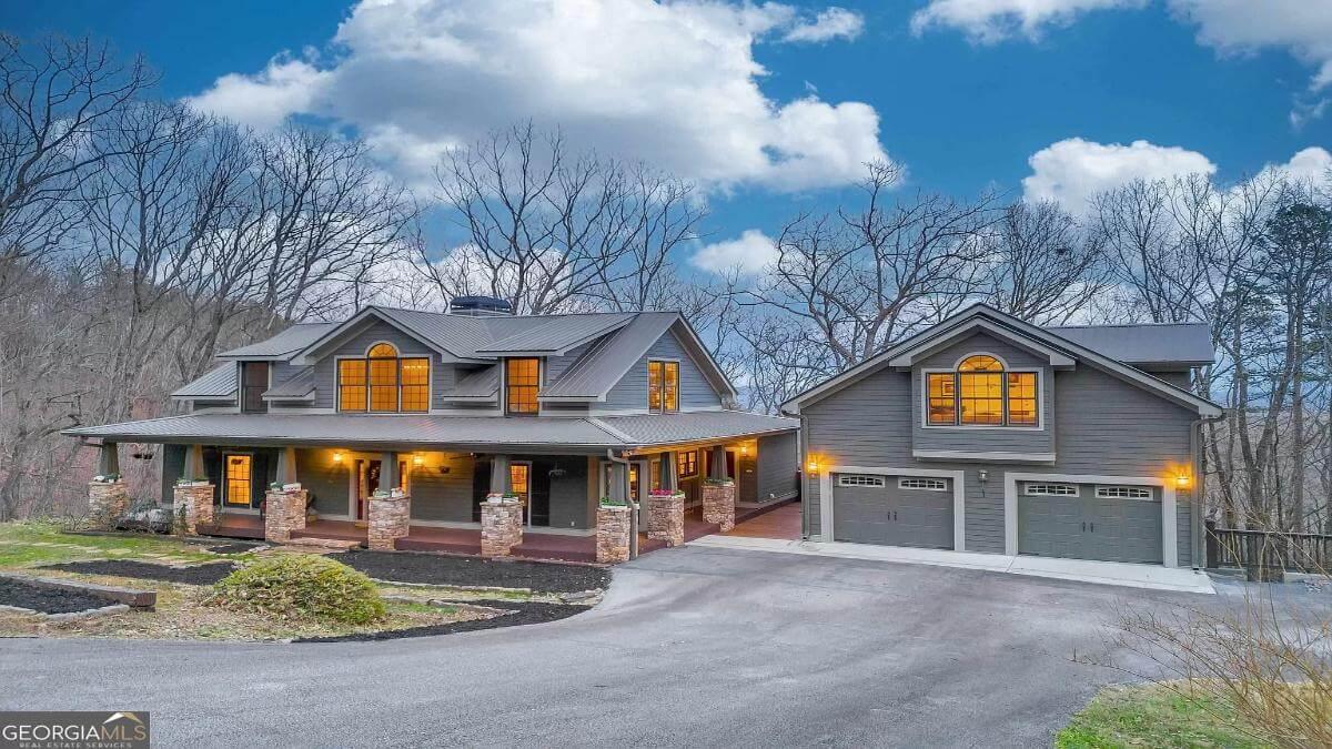 Craftsman Charm with a Cozy Front Porch and Stately Stone Columns