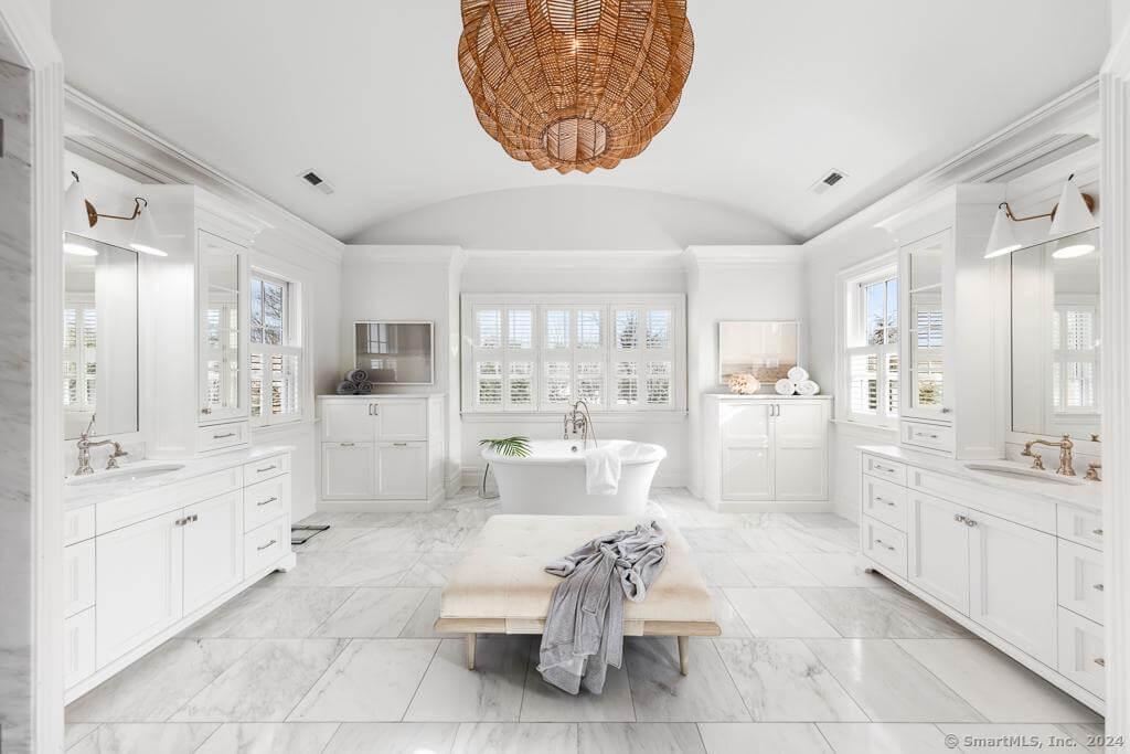 Spacious Bathroom Oasis with Freestanding Tub and Woven Pendant