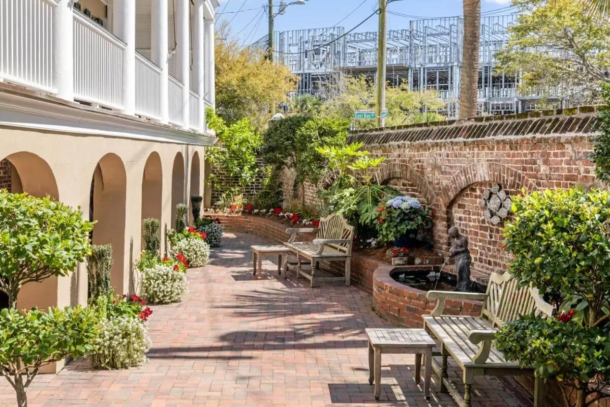 Discover This Charming Courtyard with Brick Accents and Elegant Arches