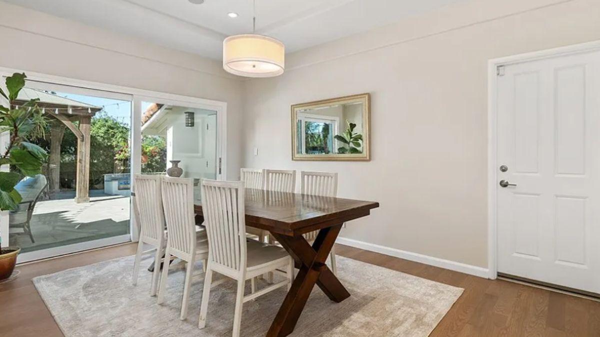 Elegant Dining Room with French Doors Leading to a Pergola