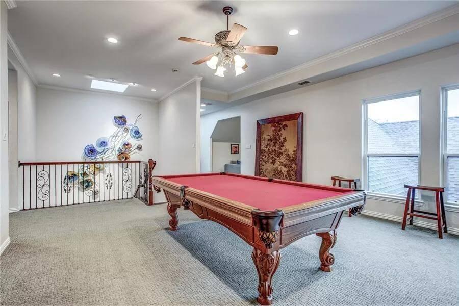 Game Room with a Striking Red Felt Pool Table