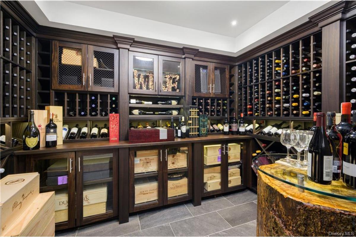 Check Out This Lavish Wine Cellar with Elegant Wood Cabinetry