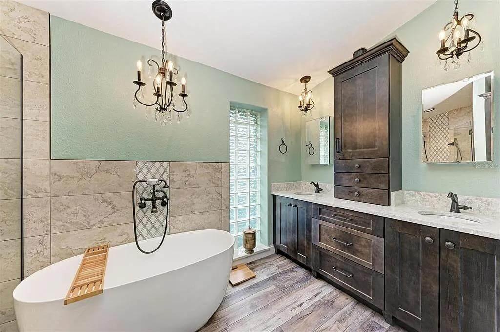 Freestanding Tub and Dark Cabinetry Create a Relaxed Bathing Sanctuary