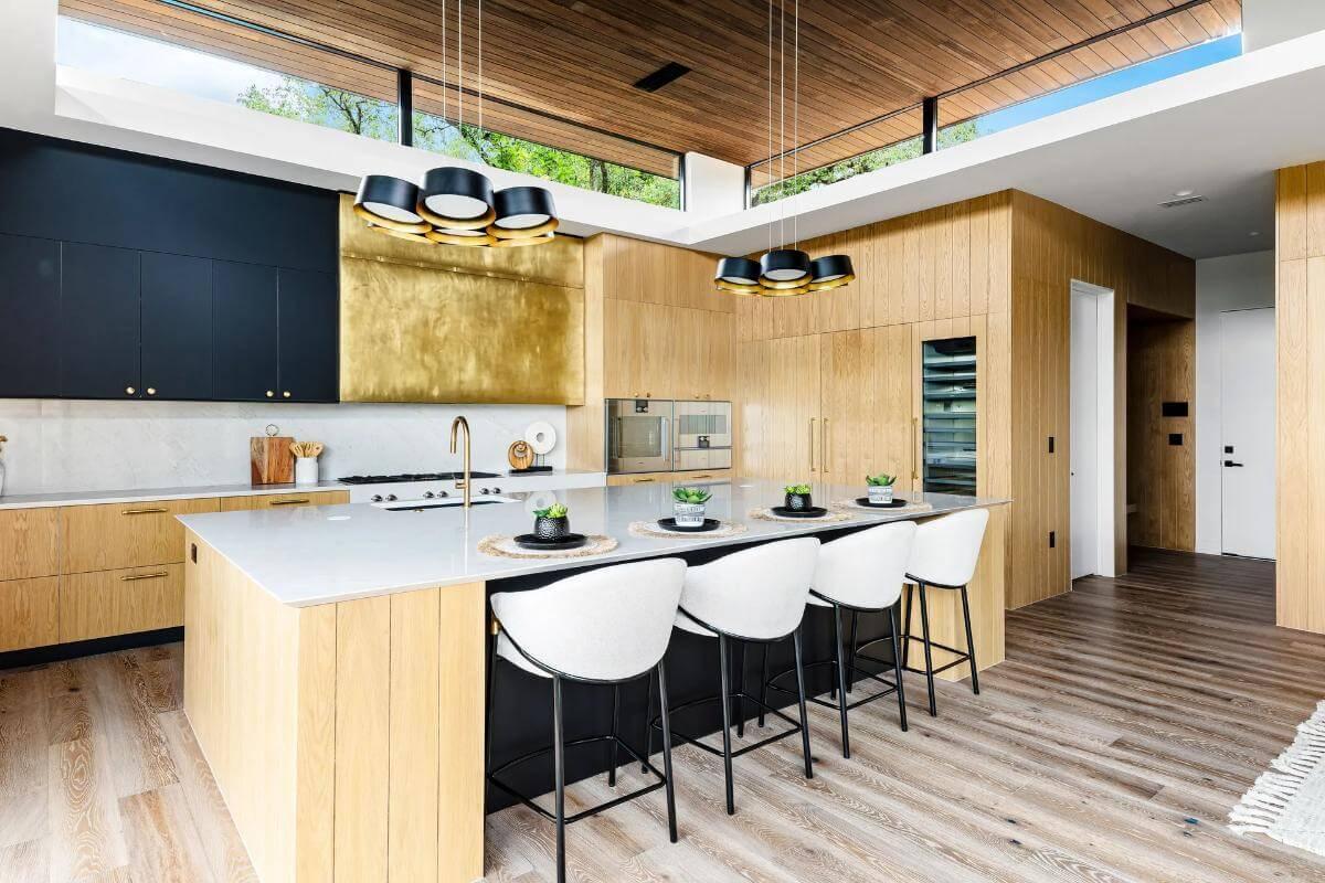 Check Out the Bold Brass Hood in This Sleek Kitchen