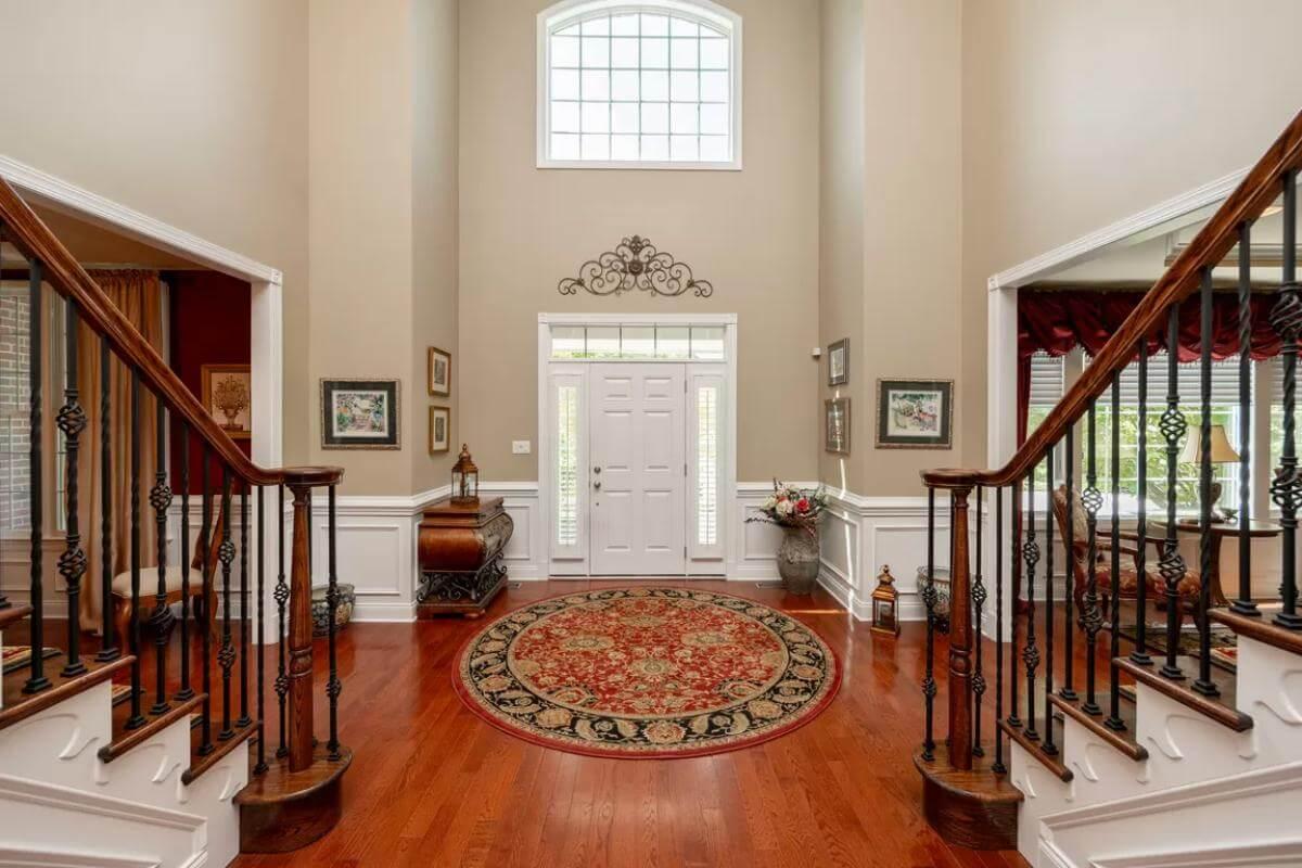 Grand Entrance with Dual Staircases and Traditional Charm