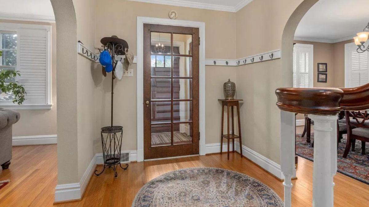 Notice the Glass Paneled Door Adding Charm to This Foyer