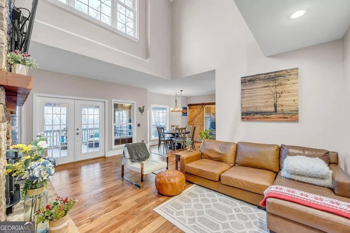Enjoy This Open Living Space with Floor-to-Ceiling Windows