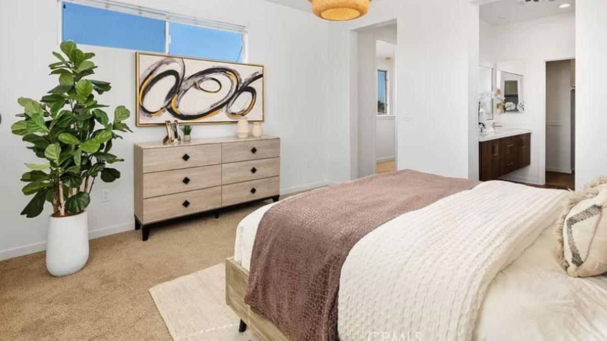 Serene Bedroom with Modern Art and Earthy Touches