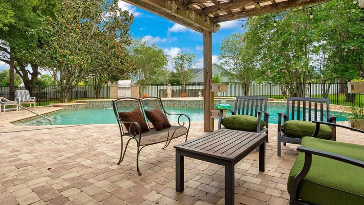 Relax Under the Pergola in This Poolside Retreat