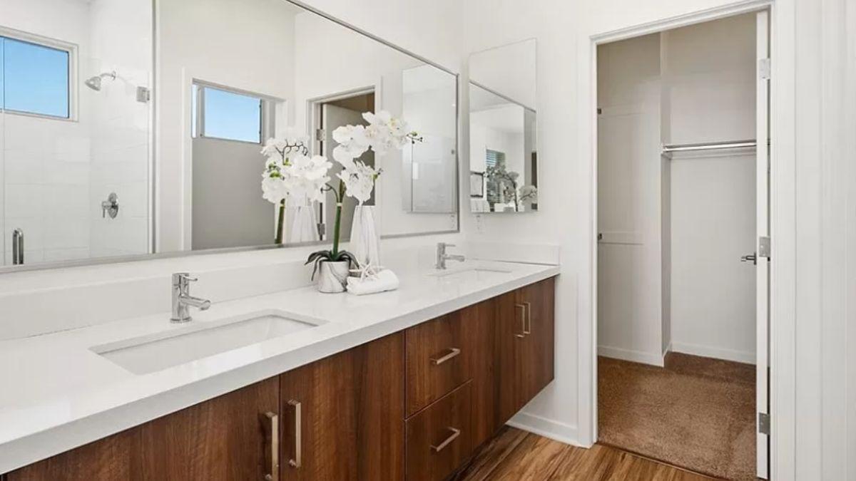 Sleek Double Vanity with Warm Wood Accents