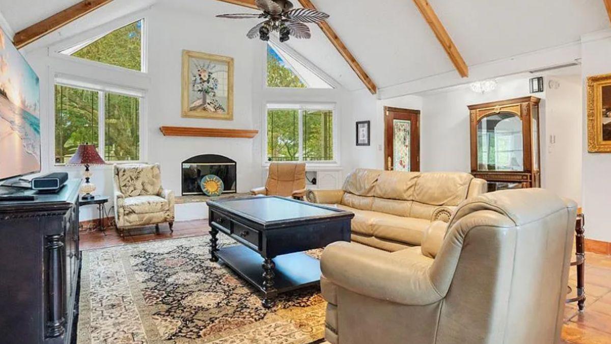 Vaulted Ceilings and Exposed Beams Enhance This Living Room