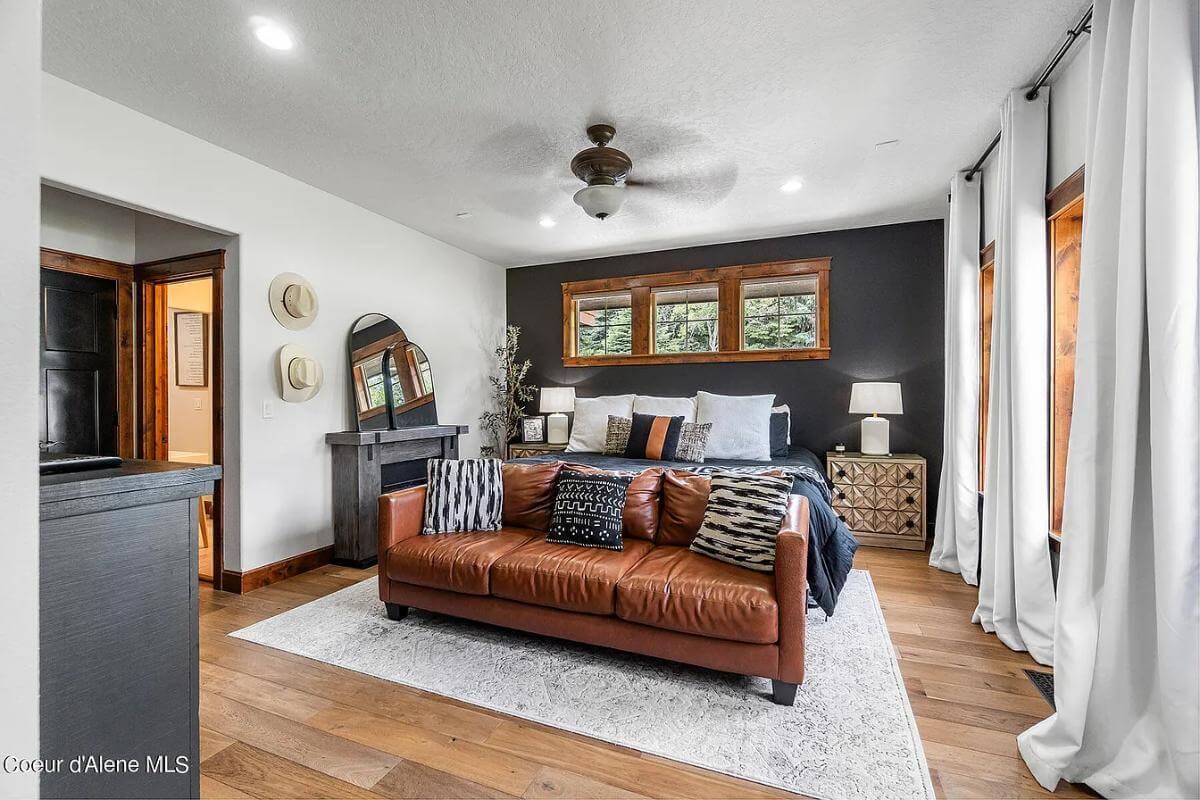 Relax in This Stylish Craftsman Bedroom Complete with a Leather Sofa