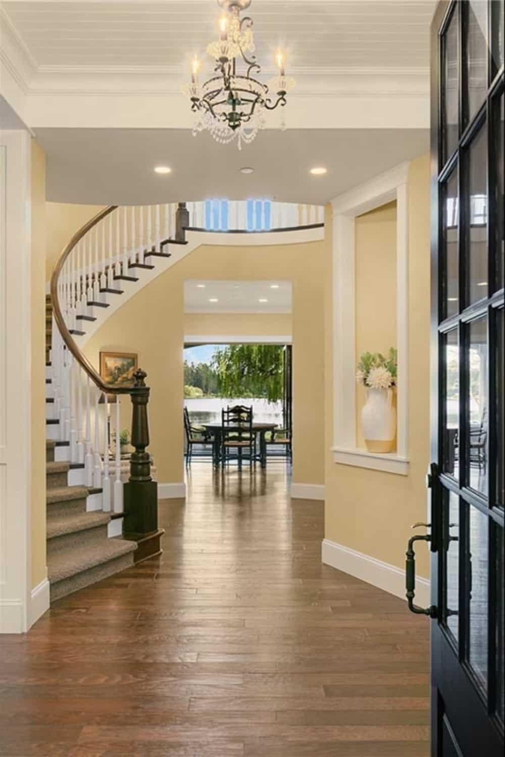 Step Inside to a Curved Staircase and Sparkling Chandelier