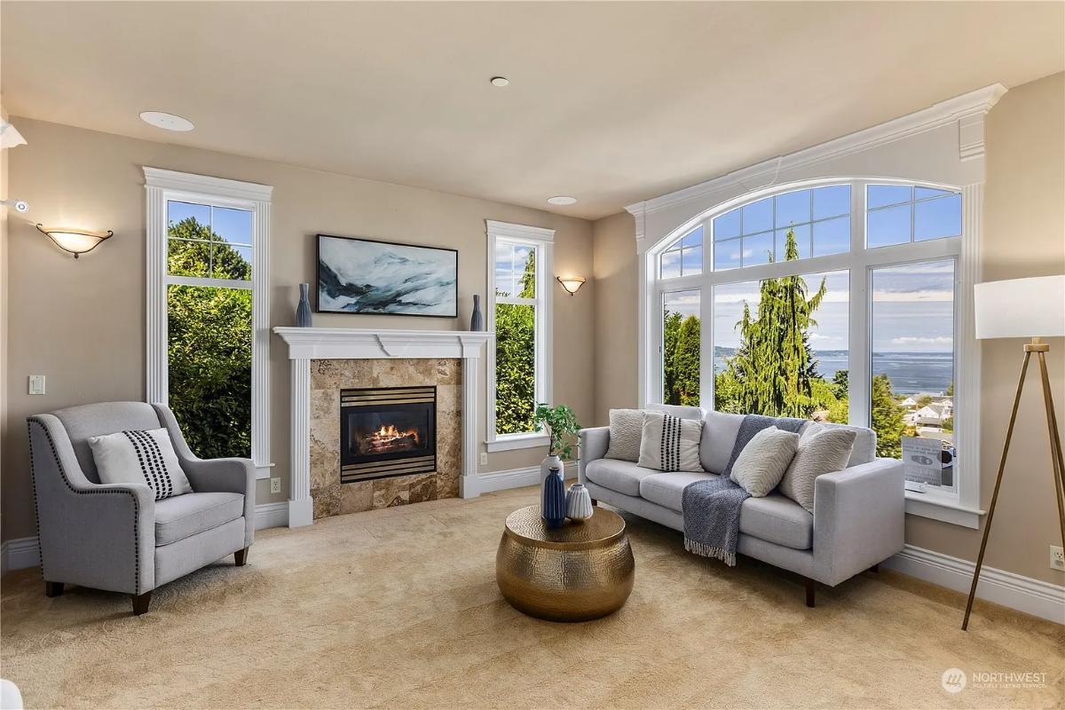 Cozy Living Room with Fireplace and Expansive Windows