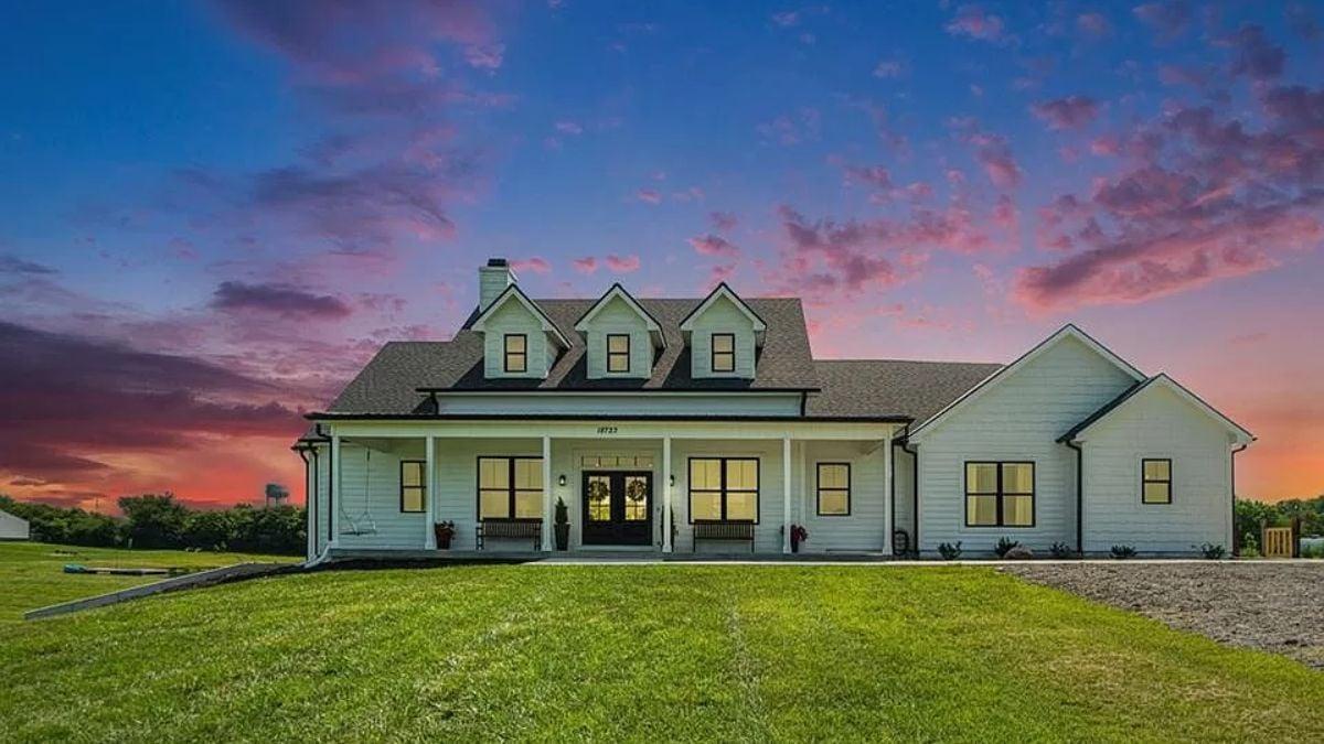 Classic Farmhouse Charm with Dormer Windows at Sunset