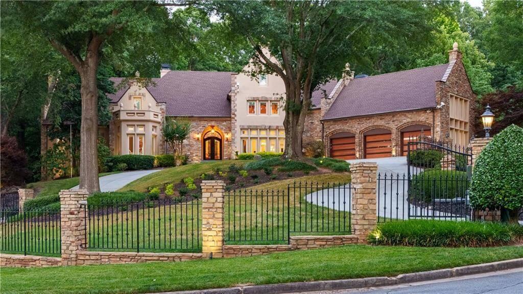 European-Inspired Stone Manor with a Charming Gated Entrance