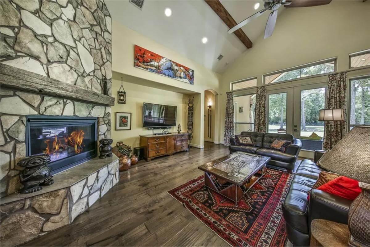 Rustic Living Room with a Striking Stone Fireplace