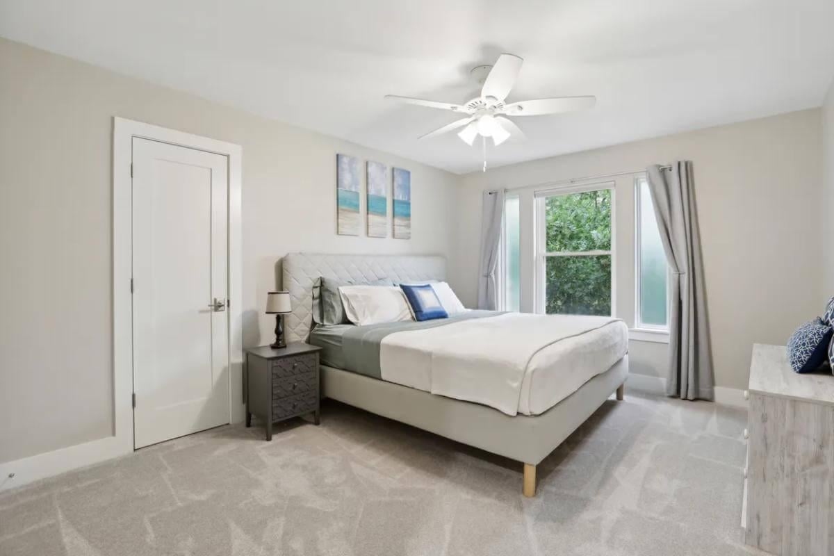 Tranquil Bedroom with a Textured Headboard and Serene Views