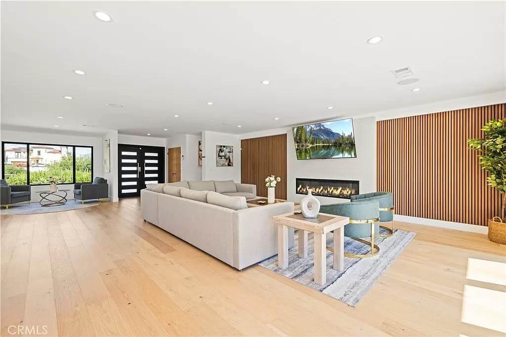 Discover This Open-Concept Living Room with a Striking Fireplace