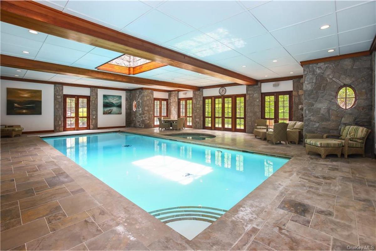 Dive into Elegance with This Indoor Pool Surrounded by Stone