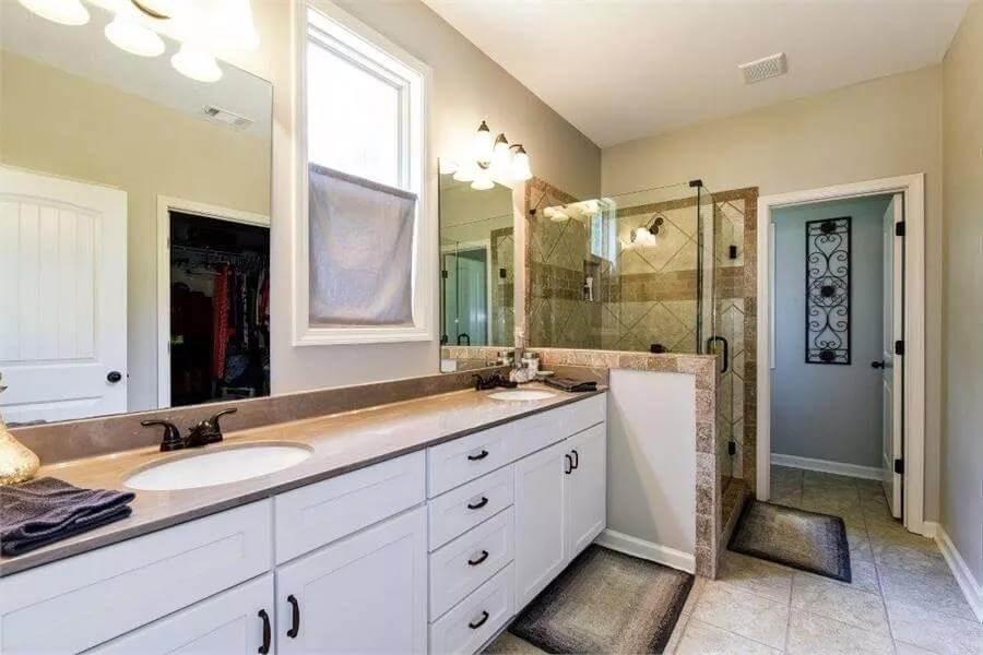 Sleek Craftsman Bathroom with Double Vanity and Glass Shower
