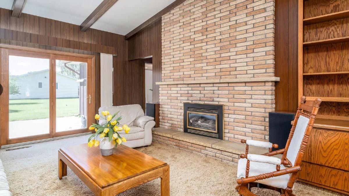 Mid-Century Vibes with a Brick Fireplace and Wood Paneling
