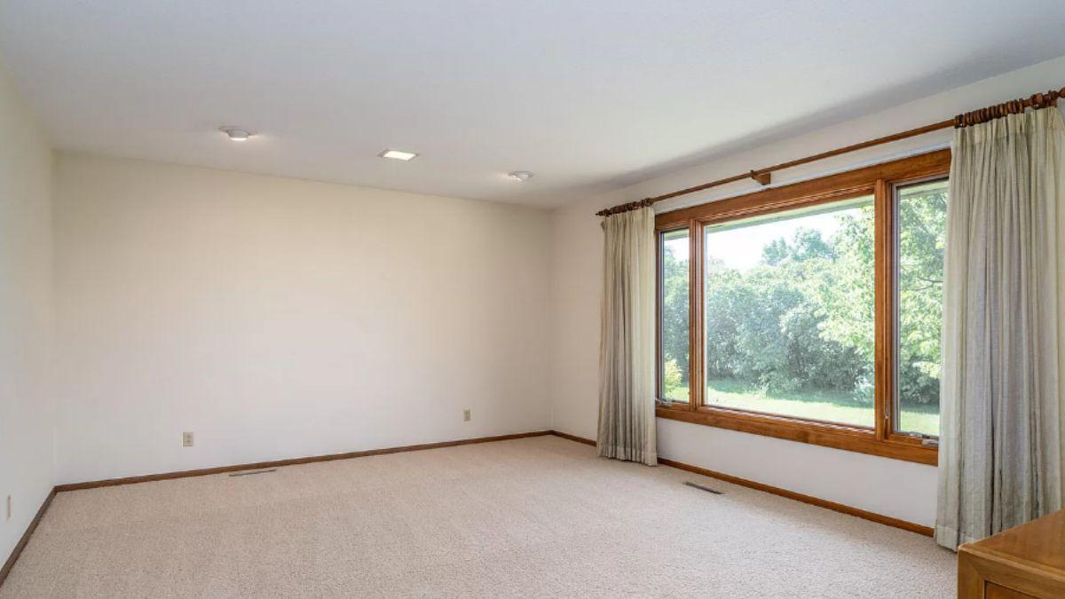 Spacious Living Room with a View Framed by Natural Wood Trim