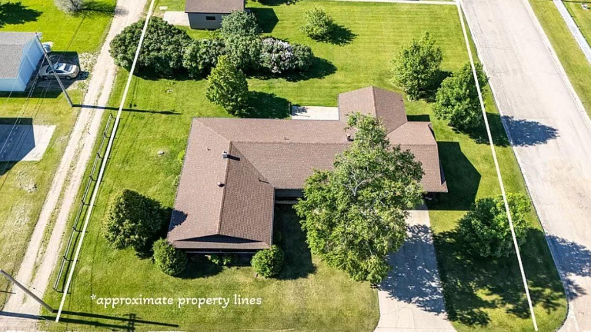 Aerial View of a Ranch Home Nestled in Lush Greenery