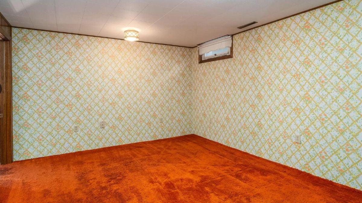 Retro Vibes with Vibrant Carpet and Patterned Wallpaper