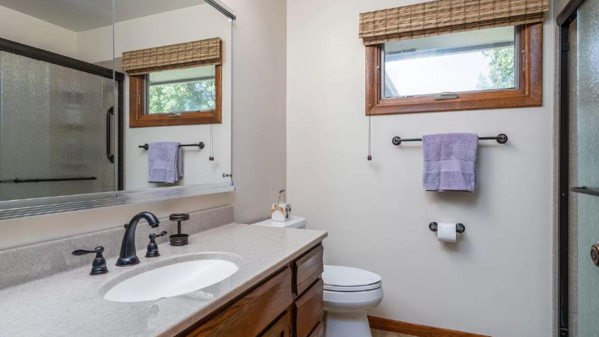 Simple Bathroom with a Splash of Natural Wood and Modern Fixtures